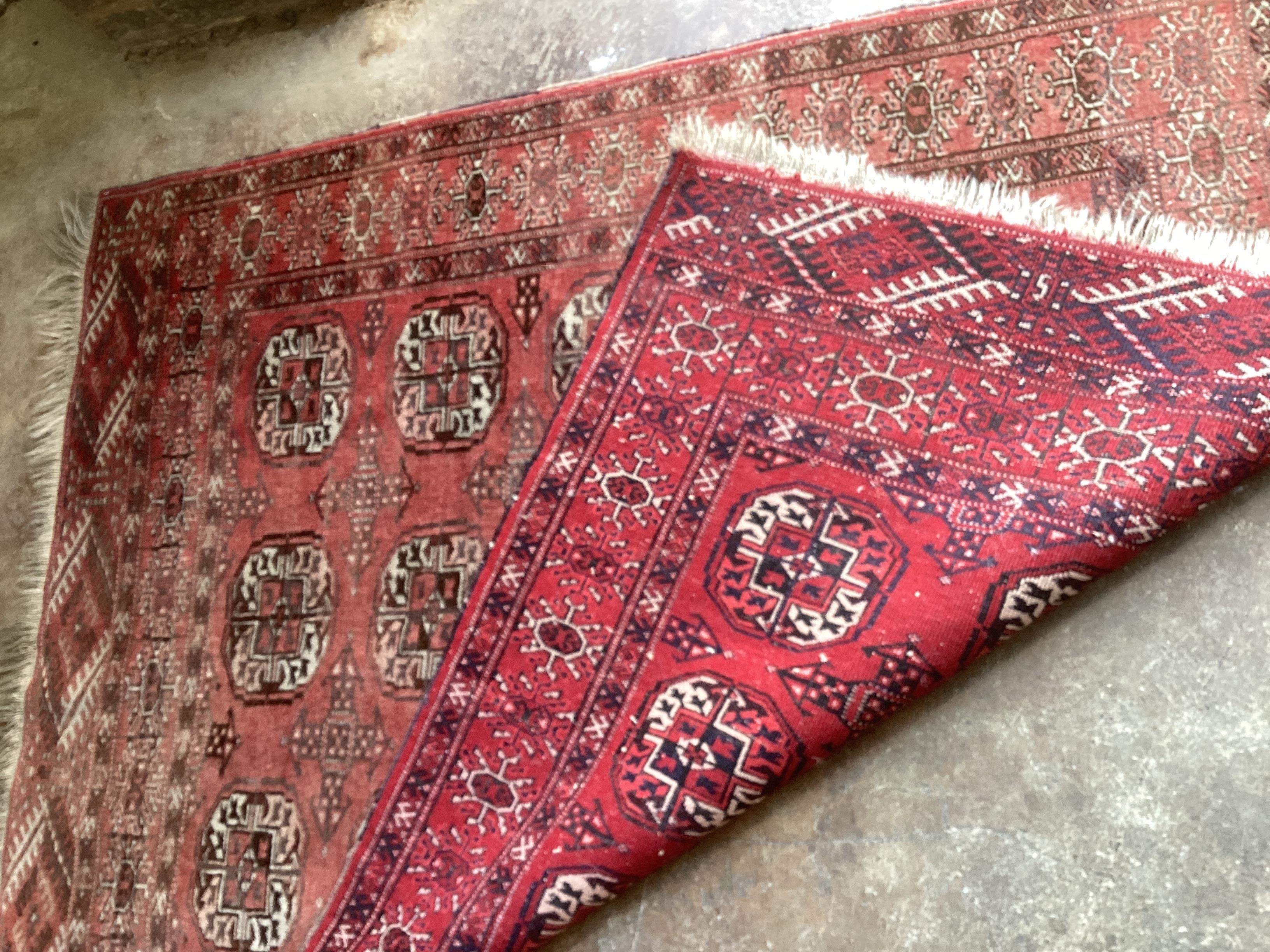 A Bokhara red ground rug, 150 x 118cm